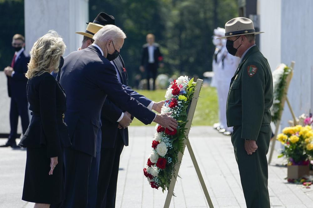 US President Joe Biden and first lady Jill Biden lay a wreath at the Wall of Names during a visit to the Flight 93 National Memorial in Shanksville, Pa., Saturday, Sept. 11, 2021.