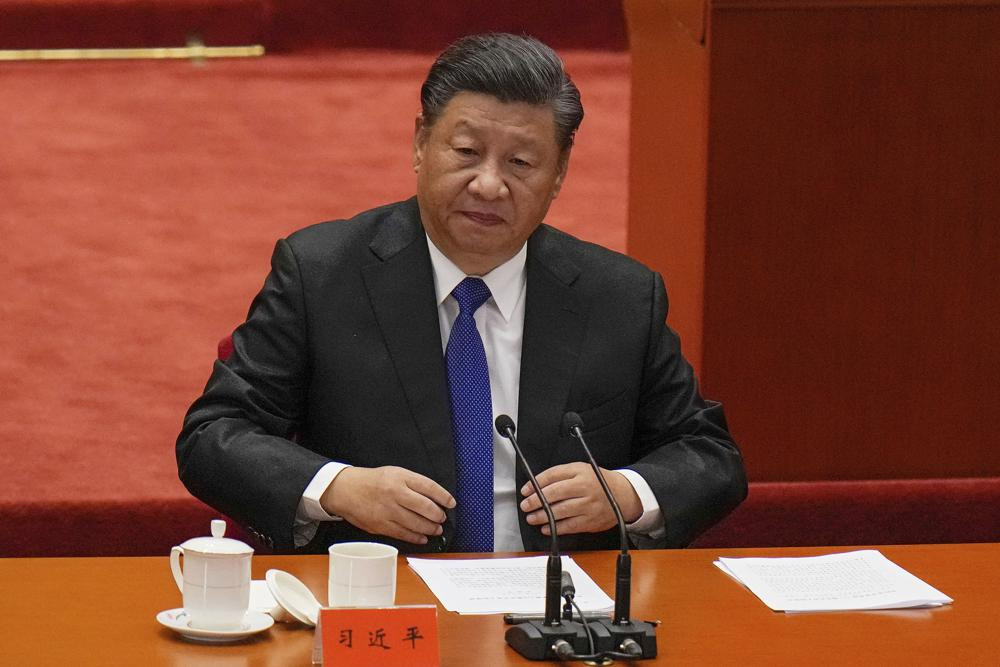 Chinese President Xi Jinping looks as he arrives at an event commemorating the 110th anniversary of Xinhai Revolution at the Great Hall of the People in Beijing, Saturday, Oct. 9, 2021.