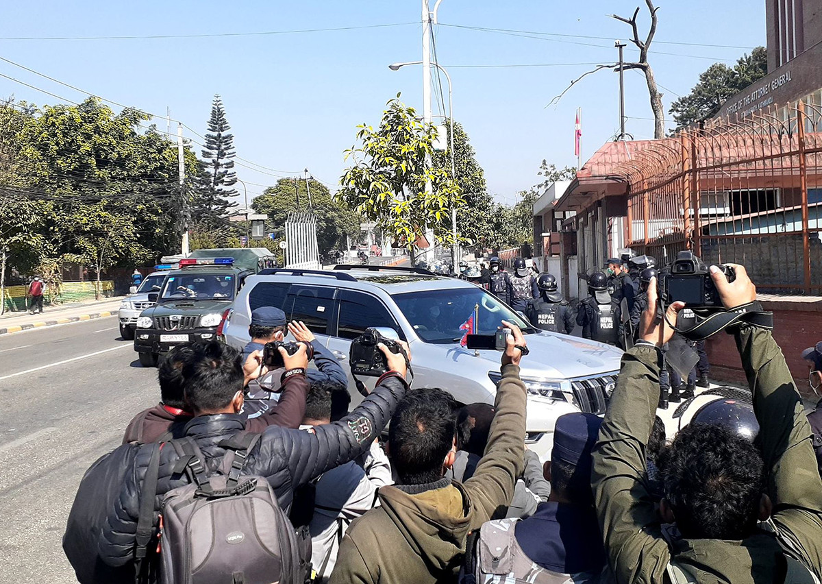 Chief Justice (CJ) Cholendra Shumsher Rana enters the SC premises through an alternative gate avoiding a sit-in by the Nepal Bar Association (NBA) at the main gate on Friday.