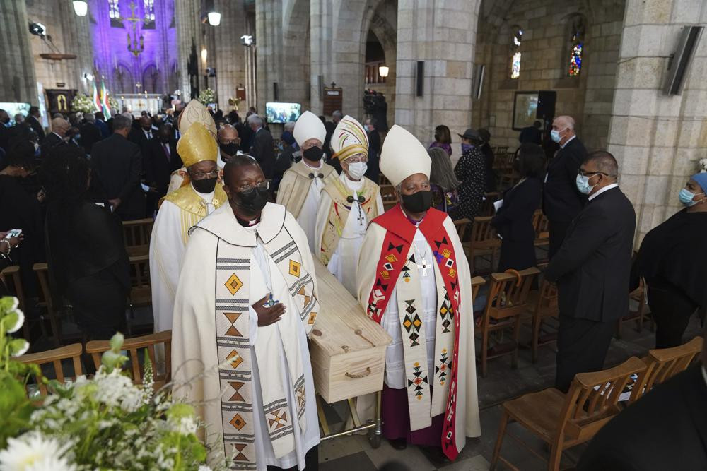 The coffin is carried out of the cathedral at the end of the funeral service for Anglican Archbishop Emeritus Desmond Tutu in St. George's Cathedral in Cape Town, South Africa, Saturday, Jan.