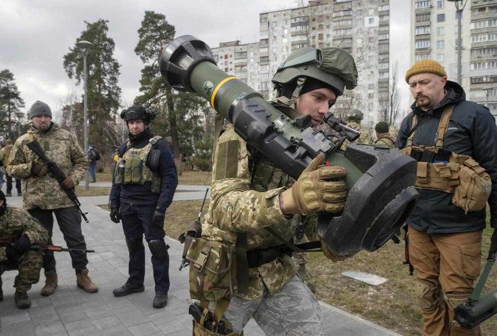 A Ukrainian Territorial Defence Forces member holds an NLAW anti-tank weapon, in the outskirts of Kyiv, Ukraine, March 9, 2022.