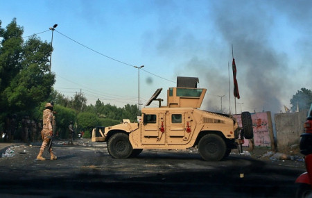 Iraq blames 'malicious' hands as toll from unrest crosses 100