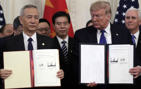 President Donald Trump holds the signed a trade agreement with Chinese Vice Premier Liu He, in the East Room of the White House, Wednesday, Jan. 15, 2020, in Washington.