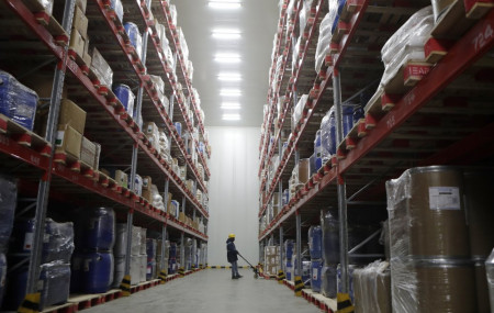 A worker moves boxes at Snowman Logistics, India's largest cold storage company in Taloja, on the outskirts of Mumbai, India, Saturday, Oct. 17, 2020.