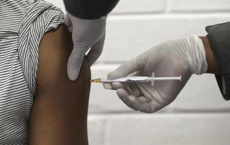 In this Wednesday, June 24, 2020 file photo, a volunteer receives AstraZeneca vaccine at the Chris Hani Baragwanath hospital in Soweto, Johannesburg.