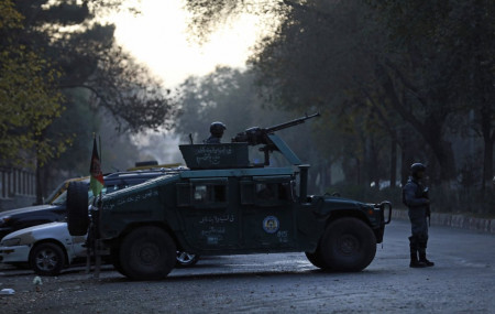 Afghan police patrol at the site of an attack at Kabul University in Kabul, Afghanistan, Monday, Nov. 2, 2020.