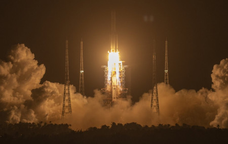 A Long March-5 rocket carrying the Chang'e 5 lunar mission lifts off at the Wenchang Space Launch Center in Wenchang in southern China's Hainan Province, early Tuesday, Nov. 24, 2020.