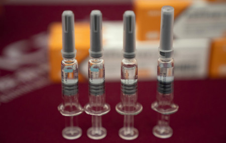 In this Sept. 24, 2020, file photo, syringes of SARS CoV-2 Vaccine for COVID-19 produced by Sinovac are displayed during a media tour of its factory in Beijing.