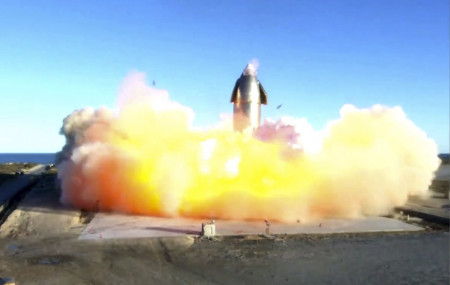 In this image taken from video posted by SpaceX, the company's Starship becomes engulfed in flames and ruptures upon touching down after a test flight, Wednesday, Dec. 9, 2020, in a remote ar