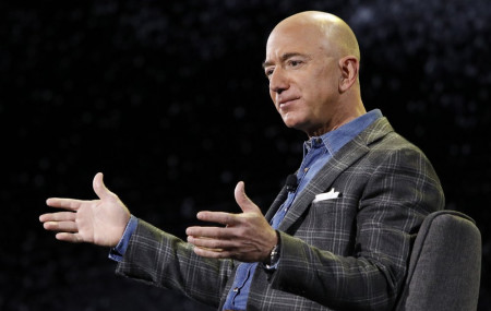 In this Thursday, June 6, 2019, file photo, Amazon CEO Jeff Bezos speaks at the Amazon re:MARS convention, in Las Vegas.