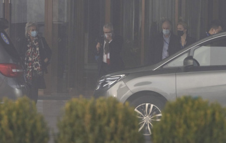 Members of a World Health Organization team leave their hotel on a foggy day for another day of field visit in Wuhan in central China's Hubei province on Wednesday, Feb. 3, 2021.