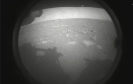 This photo made available by NASA shows the first image sent by the Perseverance rover showing the surface of Mars, just after landing in the Jezero crater, on Thursday, Feb. 18, 2021.