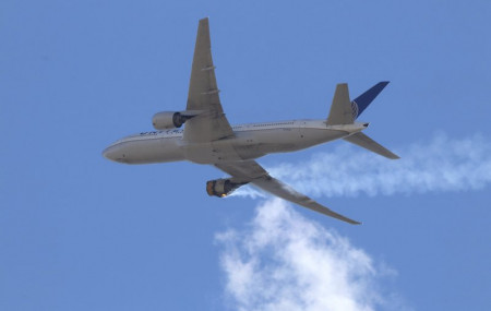 This Saturday, Feb. 20, 2021 photo provided by Hayden Smith shows United Airlines Flight 328 approaching Denver International Airport, after experiencing "a right-engine failure" shortly afte