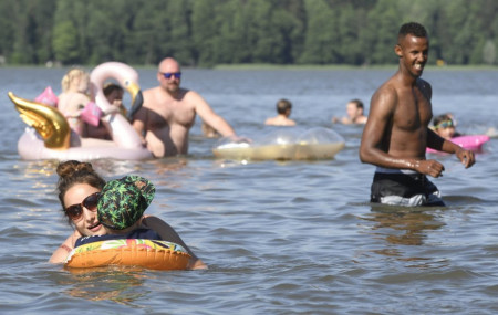 People enjoy hot summer day in a lake in Espoo, Finland, on June 26, 2020.