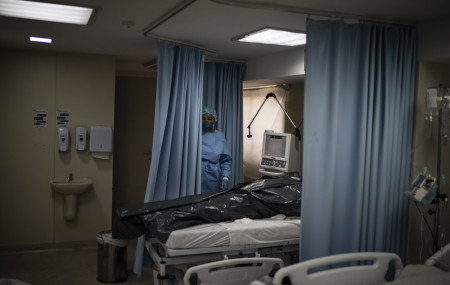 The body of a COVID-19 victim lies in a body bag at the ICU of the Sao Jose municipal hospital in Duque de Caxias, Brazil, Wednesday, March 24, 2021.