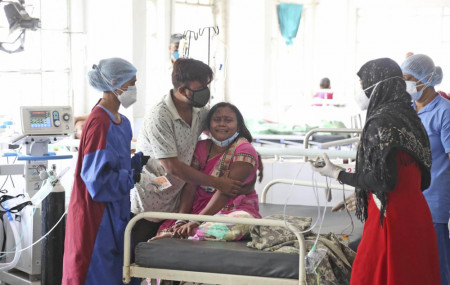 A woman cries after her husband died of a leakage in the oxygen plant of a hospital in Nashik.