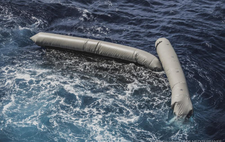 Debris from a dinghy which was supposedly carrying over 100 migrants are seen floating in the Mediterranean Sea northeast of the Libyan capital, Tripoli, Thursday, April 22, 2021.