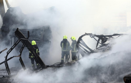 Firefighters work to extinguish burning fuel tankers in Kabul, Afghanistan, Sunday, May 2, 2021.