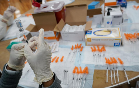 In this April 8, 2021, file photo, a Northwell Health registered nurses fills a syringe with the Johnson & Johnson COVID-19 vaccine at a pop up vaccination site at the Albanian Islamic Cultur