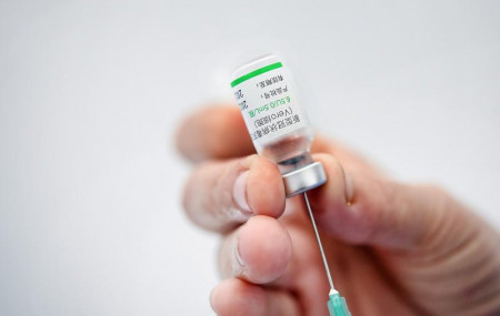 In this Friday, May 28, 2021 file photo, a healthcare worker prepares a dose of the Sinovac COVID-19 vaccine during a vaccination session for medical staff who work at private clinics in Cara