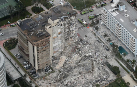 This aerial photo shows part of the 12-story oceanfront Champlain Towers South Condo that collapsed early Thursday, June 24, 2021 in Surfside, Florida.