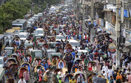 People crowd a market area ahead of Eid-al Adha in Dhaka, Bangladesh, Friday, July 16, 2021.