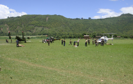 Relief and rescue workers unloading essential medical supplies at the Chaurjhari airstrip, Rukum in response to the diarrhea outbreak in Jajarkot during 2009 monsoon.