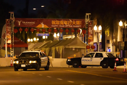 Two police vehicles are seen near a building where a shooting occurred in Monterey Park, Calif., Sunday, Jan. 22, 2023. AP/RSS Photo