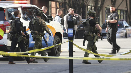 Multiple agencies arrive at a building after a shooting took place in Louisville, Ky., Monday, April 10, 2023. AP/RSS Photo