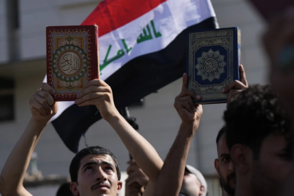 FILE - Supporters of the Shiite cleric Muqtada al-Sadr raise the Quran, the Muslims’ holy book, during a demonstration in front of the Swedish Embassy in Baghdad, on June 30, 2023, in response to the burning of Quran in Sweden. Protesters angered by the burning of a copy of the Quran stormed the Swedish Embassy in Baghdad early Thursday, July 20, 2023, online videos purported to show.  AP/RSS Photo