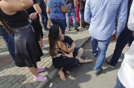 Women sit in an embrace outside the "Cantinho do Bom Pastor" daycare center after a fatal attack on children, in Blumenau, Santa Catarina state, Brazil, Wednesday, April 5, 2023. A man with a hatchet jumped over a wall and invaded the daycare center, killing four children and wounding at least five others, authorities said. AP/RSS Photo