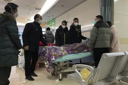 A man pulls a cloth to cover up the face of an elderly woman whose vitals flatlined as emotional relatives gather silently around her for a final farewell before her body is taken away at the emergency department of the Langfang No. 4 People's Hospital in Bazhou city in northern China's Hebei province on Thursday, Dec. 22, 2022. AP/RSS Photo