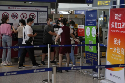 FILE - An airliner worker asks traveller to declare their health information after checking in at the international flight check in counter at the Beijing Capital International Airport in Beijing, Aug. 24, 2022. AP/RSS Photo