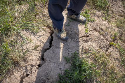 A farmer stands above a deep crack in the dried mud of an earthen embankment in his rice fields on the outskirts of Chongqing, China, Sunday, Aug. 21, 2022. AP/RSS Photo