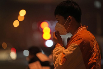 A man adjusts his mask on the street of Beijing, Sunday, Nov. 20, 2022. China on Sunday announced its first new death from COVID-19 in nearly half a year as strict new measures are imposed in Beijing and across the country to ward against new outbreaks.  AP/RSS Photo