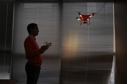FILE - A staff member from DJI Technology Co. demonstrates the remote flying with his Phantom 2 Vision+ drone inside his office in Shenzhen, south China’s Guangdong province, on Dec. 15, 2014.  AP/RSS Photo