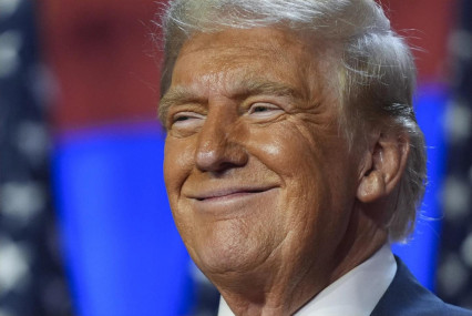 Republican presidential nominee former President Donald Trump smiles at an election night watch party at the Palm Beach Convention Center, Wednesday, Nov. 6, 2024, in West Palm Beach, Fla. (AP Photo)