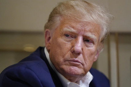 FILE - Former President Donald Trump listens as he speaks with reporters while in flight on his plane after a campaign rally at Waco Regional Airport, in Waco, Texas, on March 25, 2023, while en route to West Palm Beach, Florida. (AP/RSS Photo)