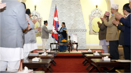 Chief Election Commissioner Dinesh Thapaliya (left) presents the election report to President Bidya Devi Bhandari at Sheetal Niwas, Kathmandu on Thursday, Dec 15, 2022.