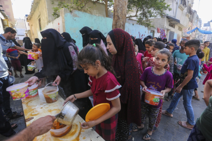 Palestinians receive food in Rafah, southern Gaza Strip, Wednesday, Nov. 8, 2023. AP/RSS Photo