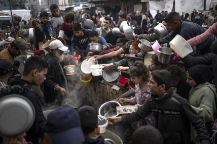 FILE - Palestinians line up for a free meal in Rafah, Gaza Strip, Thursday, Dec. 21, 2023.  AP/RSS Photo