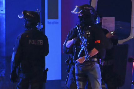 Armed police officers near the scene of a shooting in Hamburg, Germany on Thursday March 9, 2023 after one or more people opened fire in a church. The Hamburg city government says the shooting took place in the Gross Borstel district on Thursday evening. AP/RSS Photo