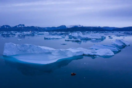 FILE - A boat navigates at night next to large icebergs near the town of Kulusuk, in eastern Greenland on Aug. 15, 2019. A new massive study finds that Greenland and Antarctic ice sheets are now losing more than three times as much ice a year as they were 30 years ago. AP/RSS Photo