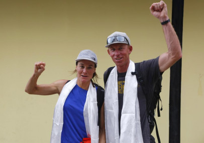 FILE- Hilaree Nelson of Telluride, Colorado, left and James Morrison of Tahoe, California, raise their fists as the pair arrive in Kathmandu, Nepal, Oct 4, 2018. (AP/RSS Photo)