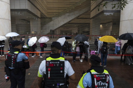 People wait outside the West Kowloon Magistrates' Courts in Hong Kong Tuesday, Nov. 19, 2024, ahead of the sentencing in national security case.  AP/RSS Photo