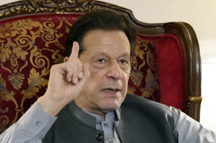 FILE - Pakistan’s former Prime Minister Imran Khan gestures during talk with reporters regarding the current political situation and the ongoing cases against him at his residence, in Lahore, Pakistan, Thursday, Aug 3, 2023. (AP/RSS Photo)