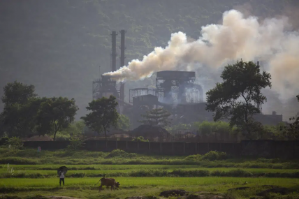 FILE - Smoke rises from a coal-powered steel plant at Hehal village near Ranchi, in eastern state of Jharkhand, Sept. 26, 2021. AP/RSS Photo