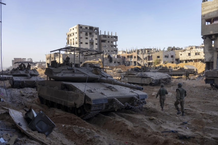 FILE - Israeli army troops are seen next to a destroyed building during a ground operation in the Gaza Strip on Nov. 8, 2023. (AP/RSS Photo)