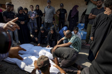 Palestinians mourn over the bodies of their relatives killed in the Israeli bombardment of the Gaza Strip, at a hospital morgue in Deir al-Balah, Tuesday, July 16, 2024. AP/RSS Photo