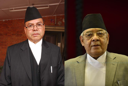FILE - Jhala Nath Khanal (left) and Bamdev Gautam
